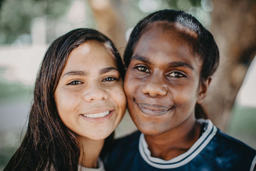 A portrait shot of two young Indigenous girls.