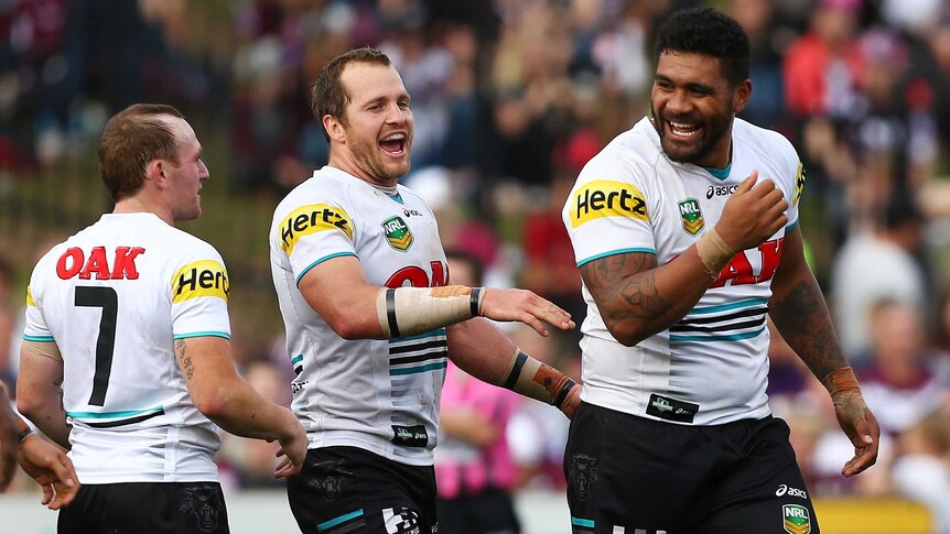 Mose Manoe (R) of the Panthers celebrates with Clint Newton (C) after his try against Manly.