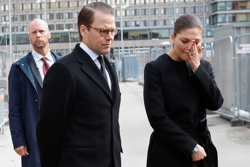 Crown Princess Victoria and Prince Daniel lay flowers