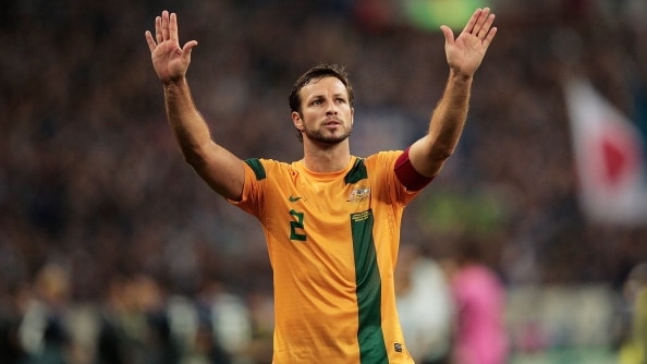 Lucas Neill thanks the crowd after Australia's match against japan
