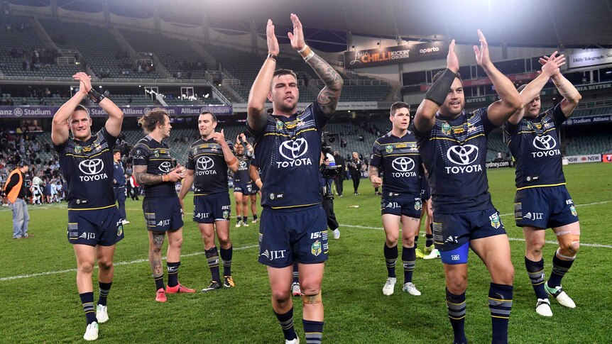 Cowboys' players celebrate their win in the NRL elimination final against Cronulla at the SFS.