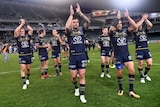 Cowboys' players celebrate their win in the NRL elimination final against Cronulla at the SFS.
