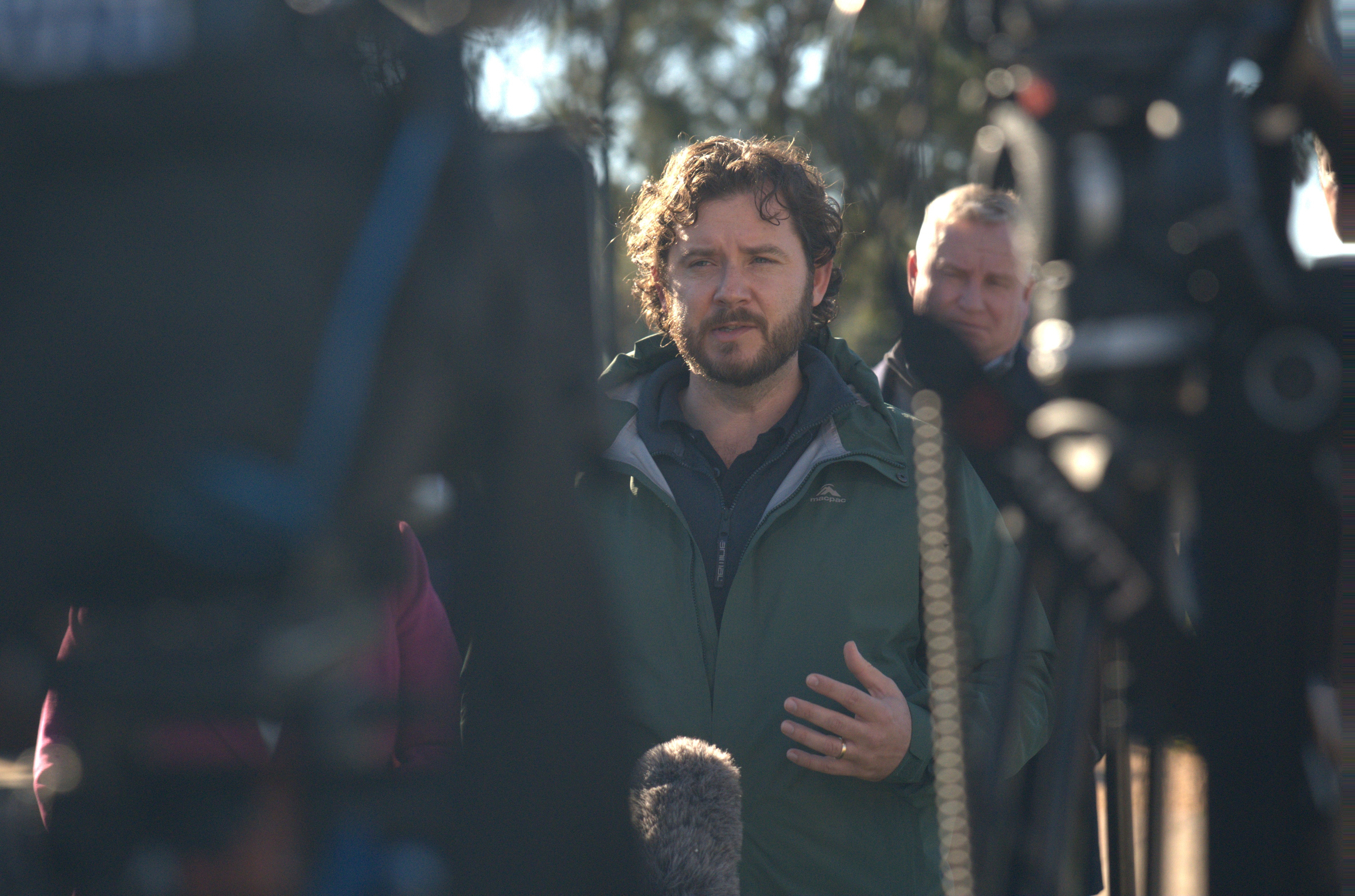 Felix Ellis speaks to reporters at a press conference.