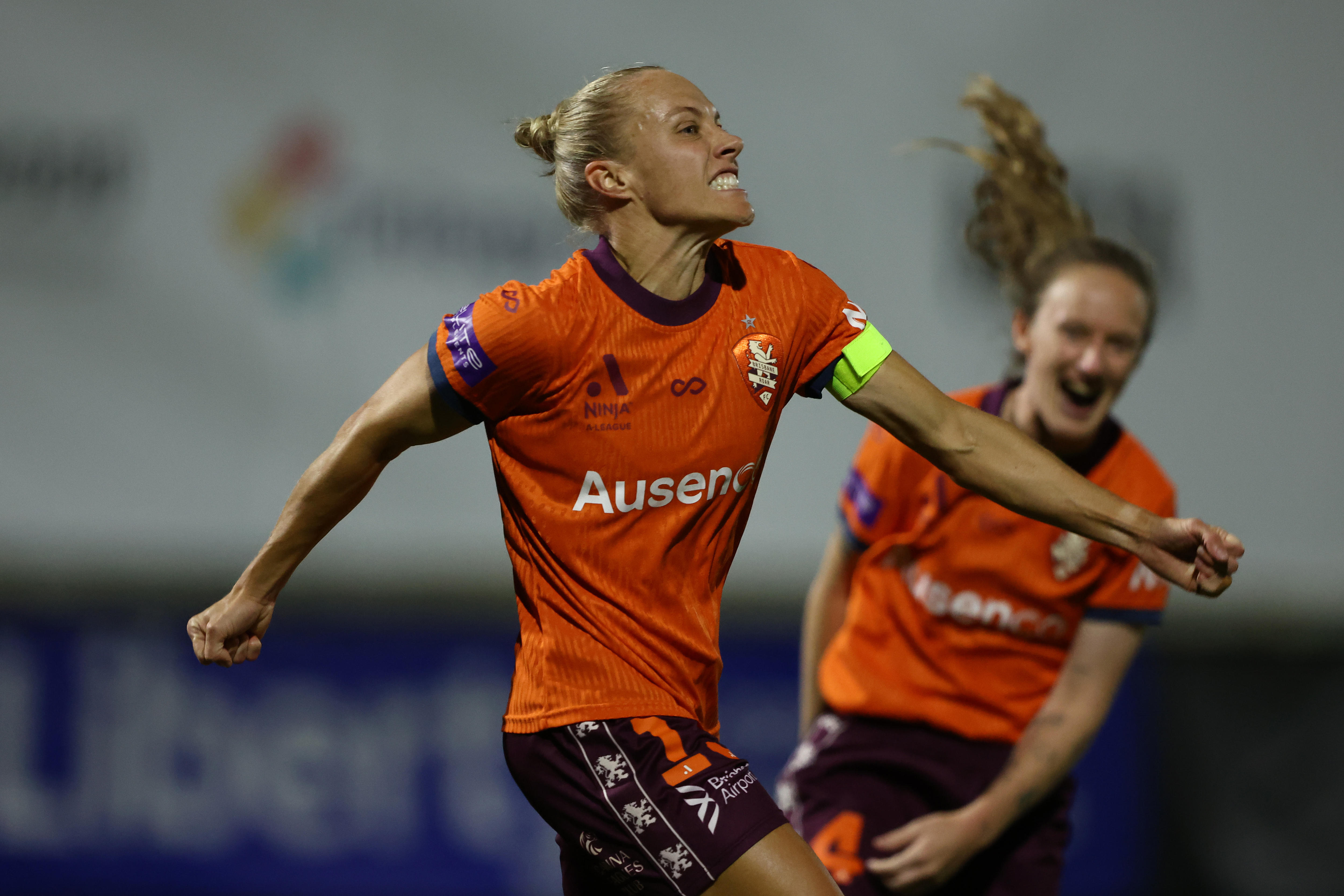 Tameka Yallop celebrates a goal for Brisbane Roar in ALW
