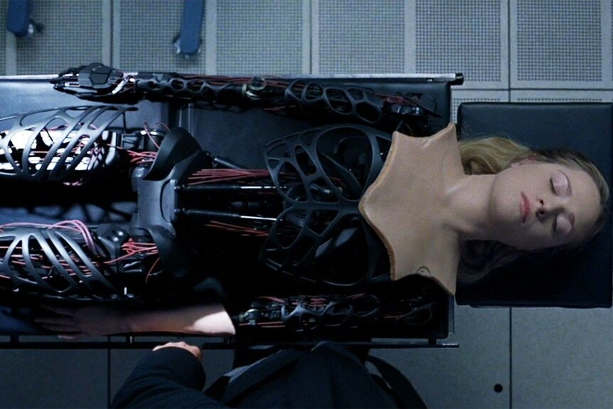 Dolores Abernathy, a character from the TV show Westworld, lying on an operating table