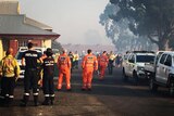State Emergency Services, volunteer and career firefighters gather at the incident control point at Waroona Oval.