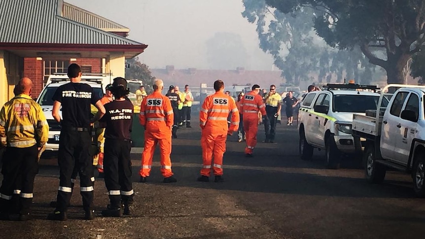 State Emergency Services, volunteer and career firefighters gather at the incident control point at Waroona Oval.