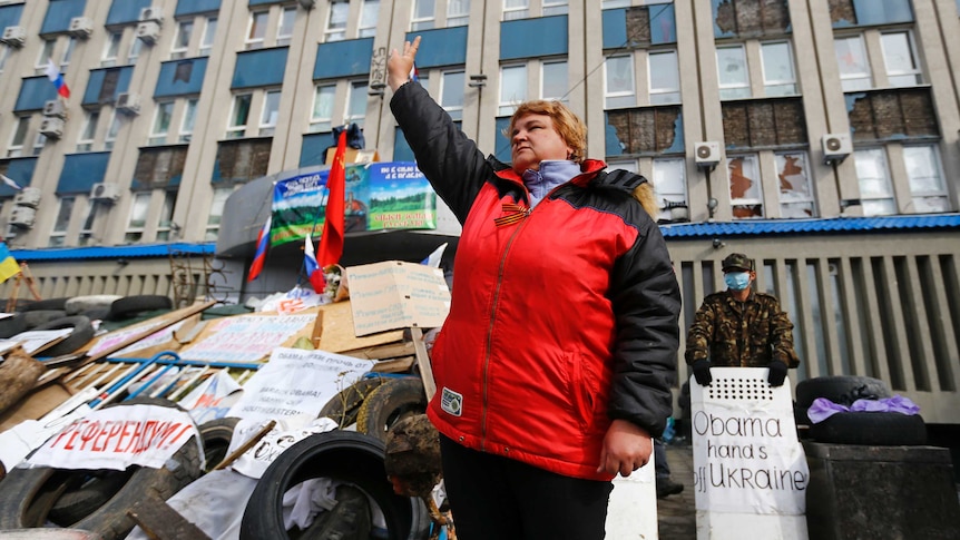 Pro-Russian protester gestures at barricade