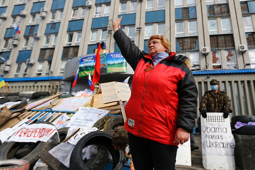 Pro-Russian protester gestures at barricade