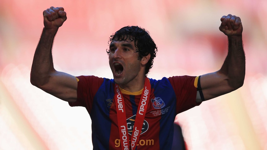 Crystal Palace captain Mile Jedinak celebrates victory in the playoff final against Watford.