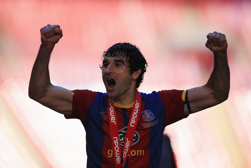Crystal Palace captain Mile Jedinak celebrates victory in the playoff final against Watford.