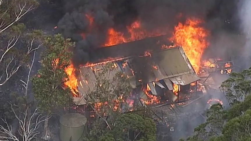 A structure alight in the bushfire at Cudlee Creek, in the Adelaide Hills.