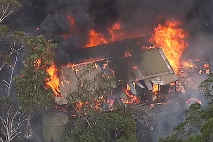 A structure alight in the bushfire at Cudlee Creek, in the Adelaide Hills.