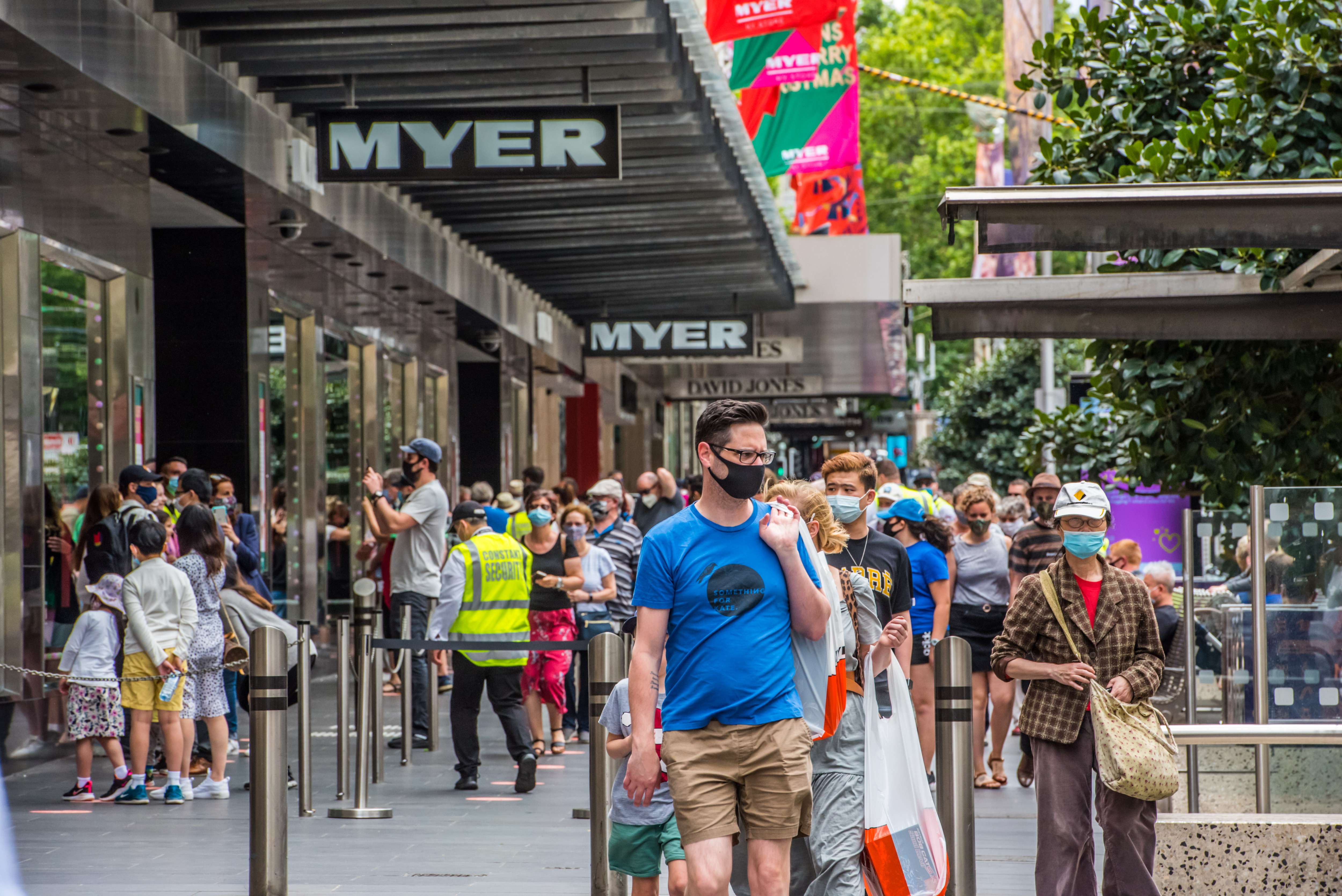 A crowd of people in the street 