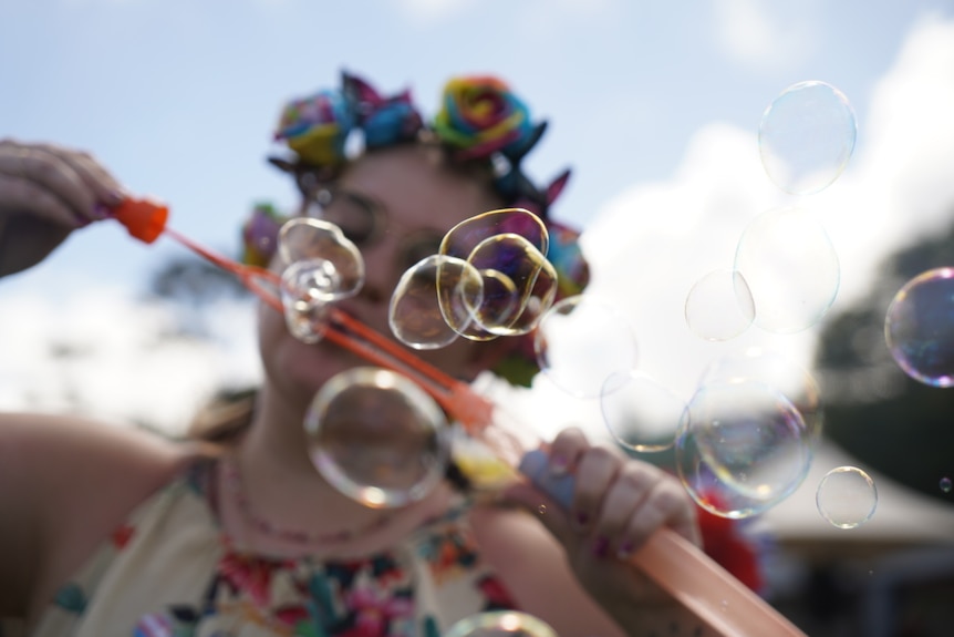 girl blowing bubbles 