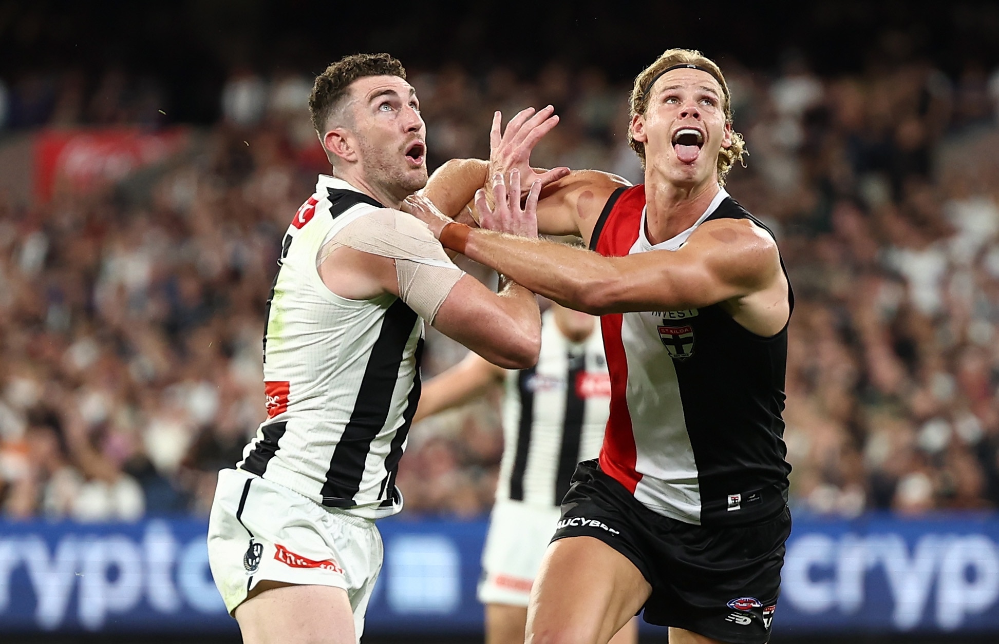 Daniel McStay of the Magpies and Tom De Koning of the Saints compete in a ruck contest during a 2026 AFL match.