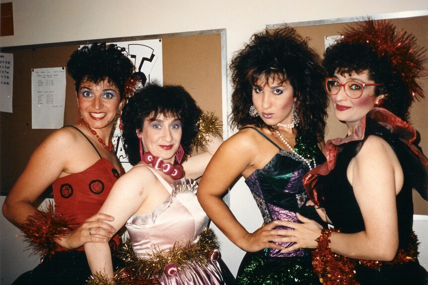 Libbi Gorr and three other women dressed in cabaret.