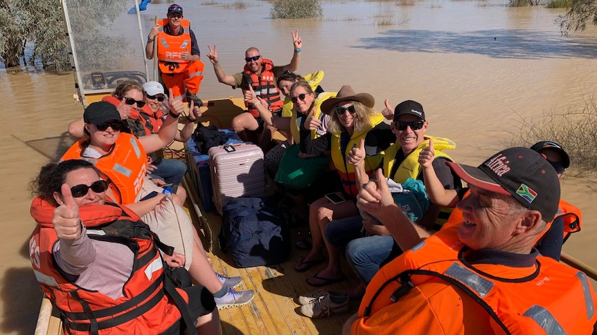 Marathon runners stranded after Birdsville cut off by rising floodwaters in the Diamantina River