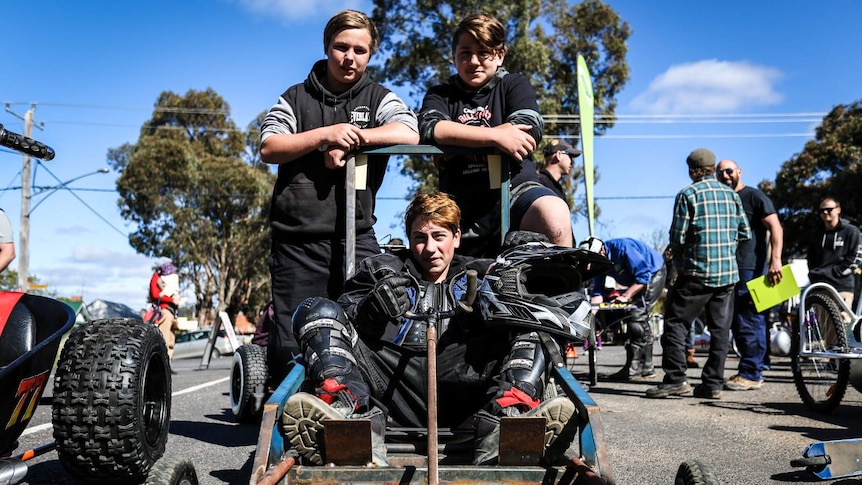 Sequani, 15 in the drivers seat with Charlie, 16 (back left) and Chase, 14 (back right) with The Time Killer billy cart.