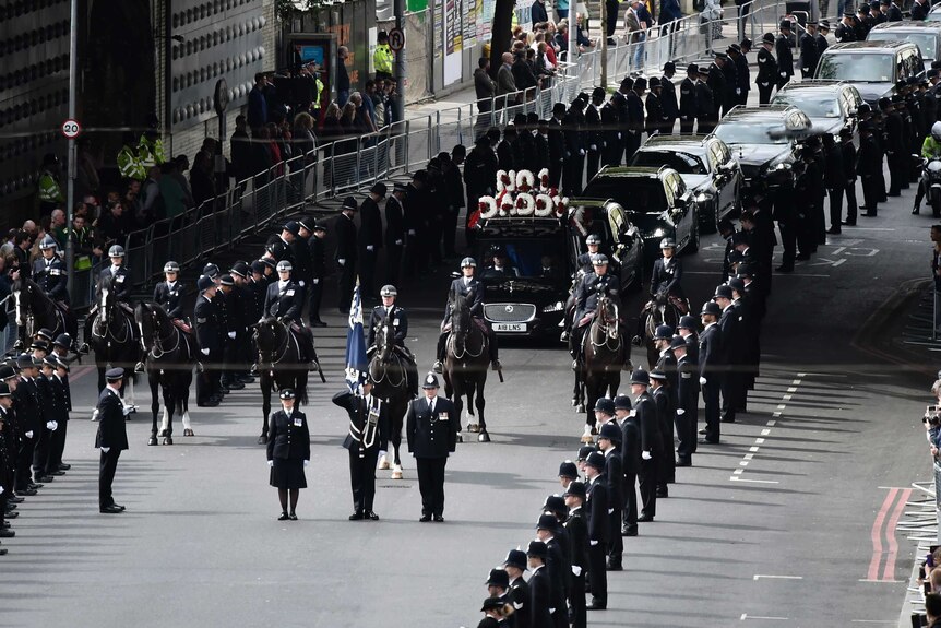 British police officers line the streets for Keith Palmer's funeral