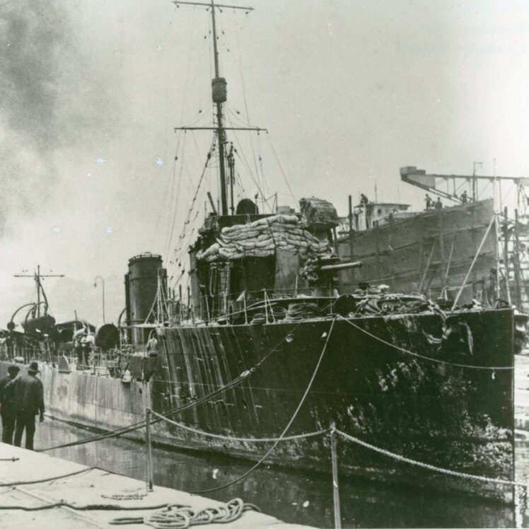 WWI naval warship docked