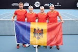four men in Moldovan tennis uniforms pose with the Moldovan national flag on a tennis court