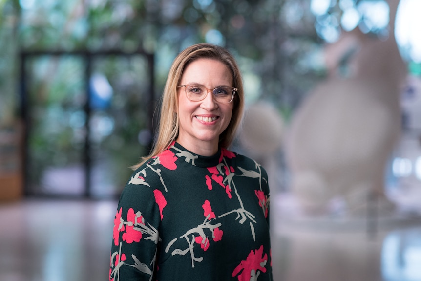 A woman poses in a professional portrait