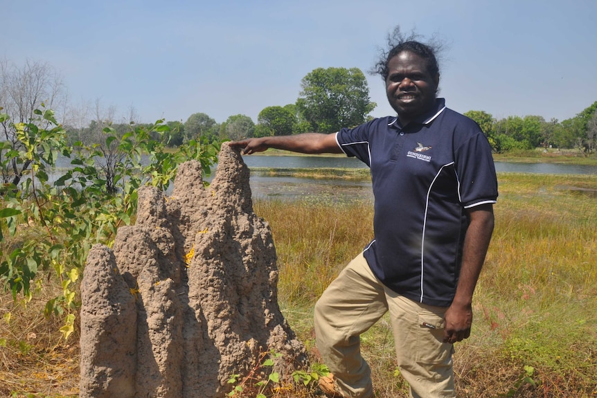 Traditional owner Simon Mudjandi standing new Jabiru Lake