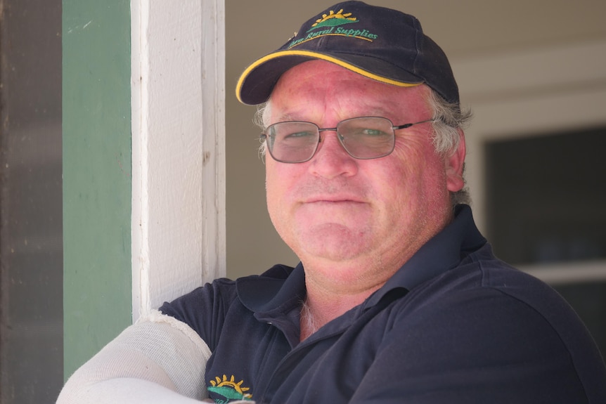 Profile of a man with his arms crossed.