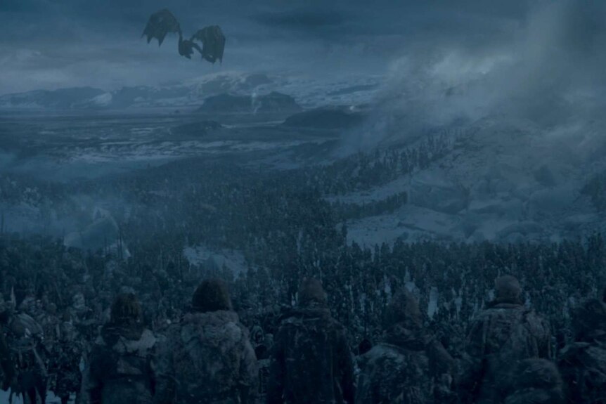 The Night King flies his dragon into the distance as thousands of undead shuffle through the hole in The Wall.