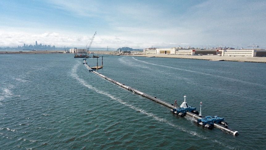 A long floating boom that will be used to collect garbage in the Pacific