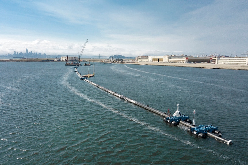 A long floating boom that will be used to collect garbage in the Pacific