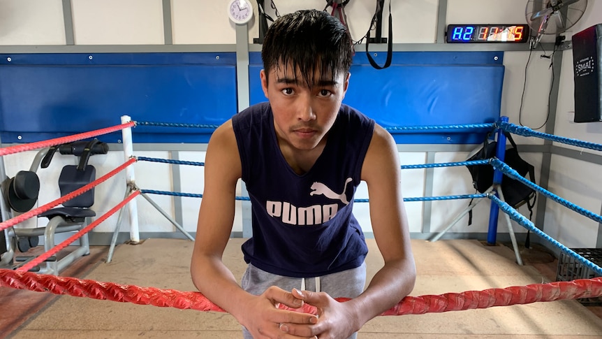 A man standing in a boxing ring.