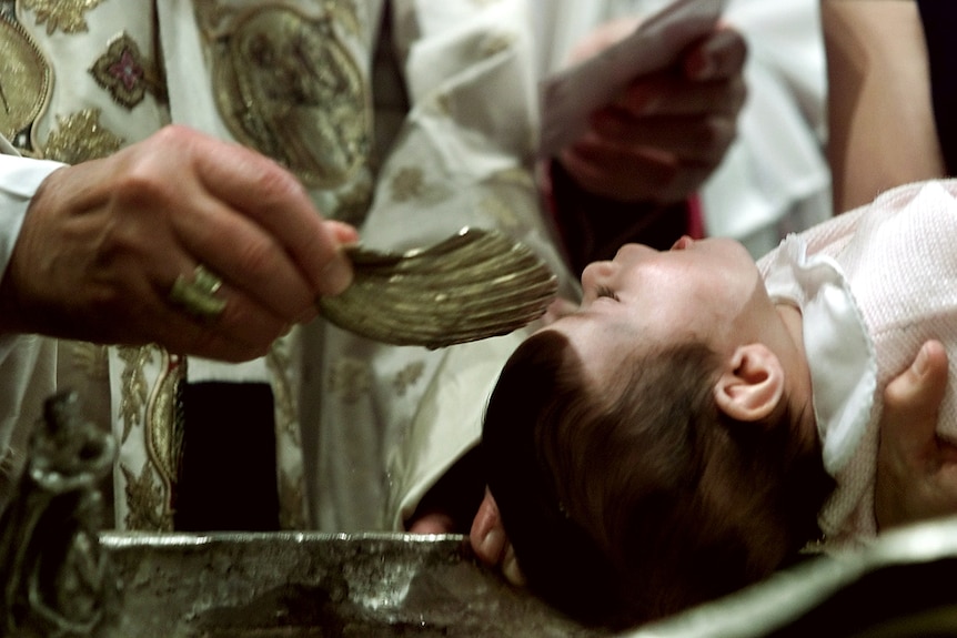 Pope John Paul II baptises baby at Sistine Chapel