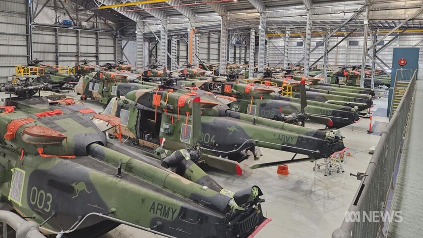 Old Taipan helicopters in a warehouse 