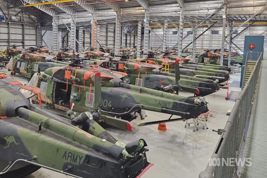 Old Taipan helicopters in a warehouse 