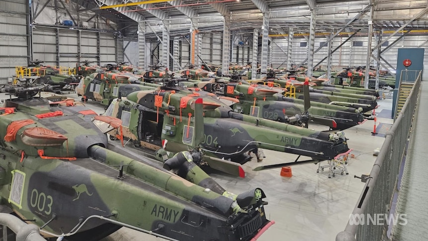 Old Taipan helicopters in a warehouse 