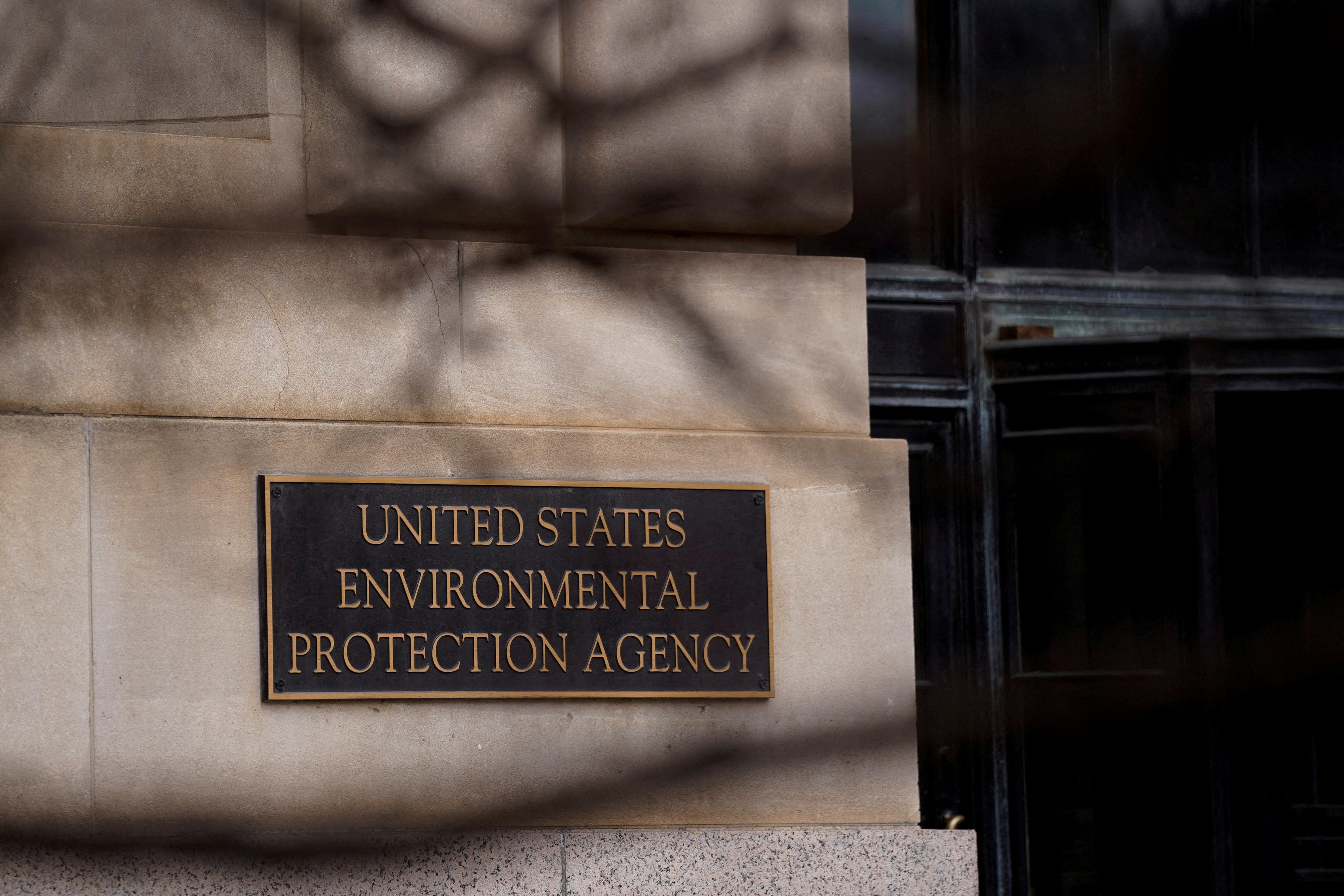 A sign plaque that says 'United States Environmental Protections Agency' on a building wall
