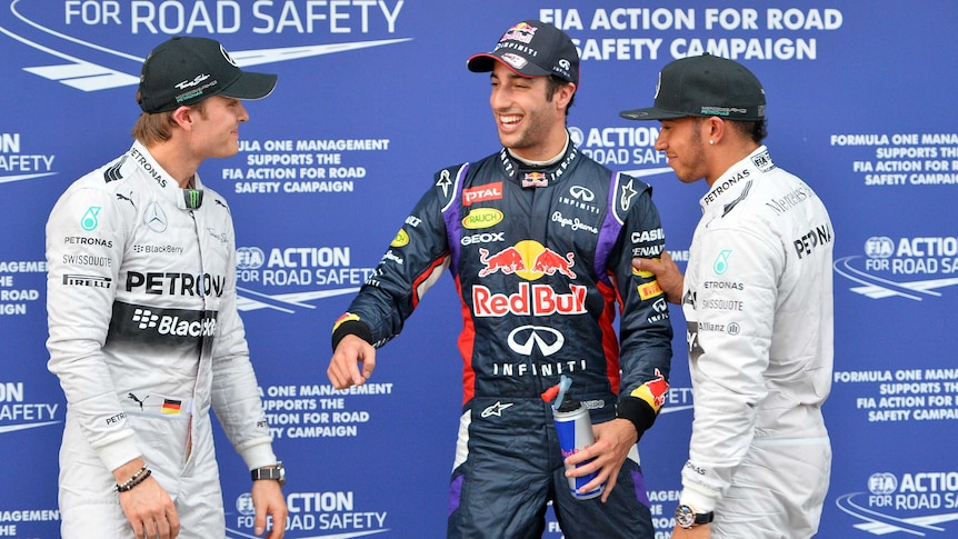 Mercedes drivers Lewis Hamilton (R) and Nico Rosberg (L) with Red Bull's Daniel Ricciardo.