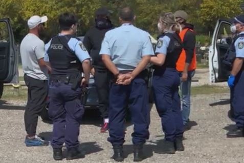 NSW Police speak to mourners at Rookwood