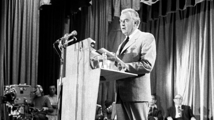 Gough Whitlam stands at It's Time podium
