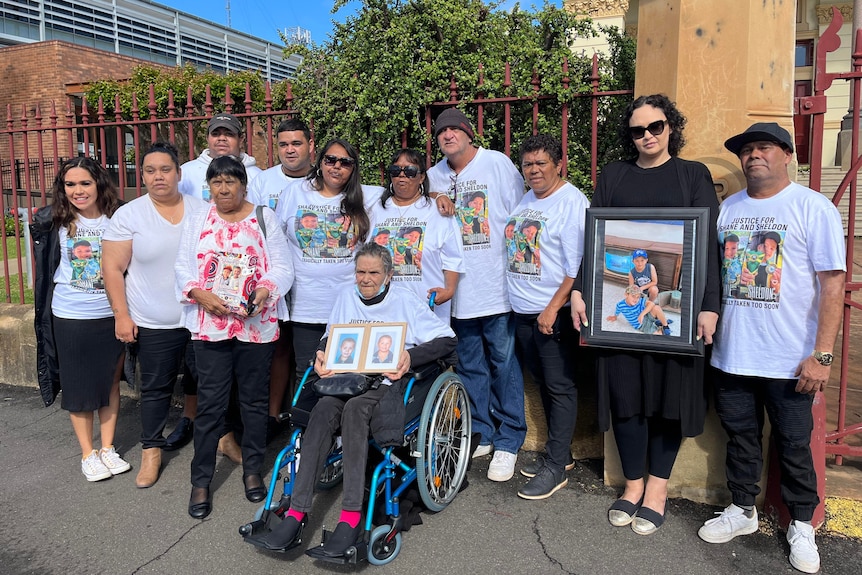 family and friends of two boys killed in Wellington stand together outside Dubbo court