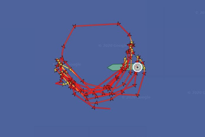 You view a satellite track map of a ship with red arrows going around in circles as it remains stranded at sea.