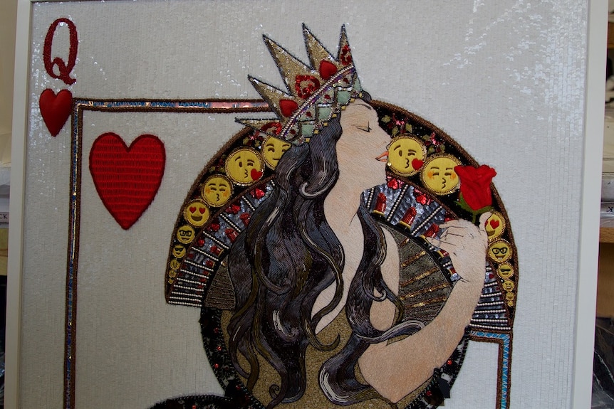An embroidered Queen of Hearts