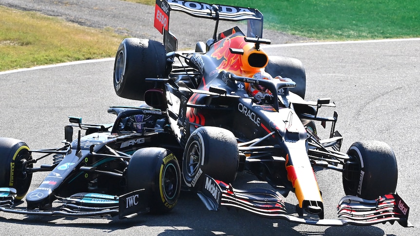 An F1 car on top of another following a crash during a race