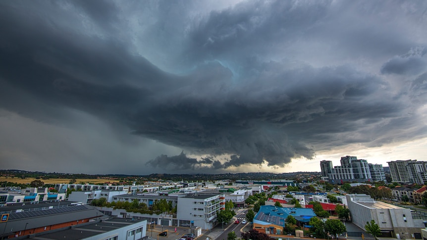 A dark storm over a town centre.