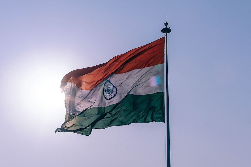 The Indian flag on a flagpole in front of the Sun