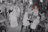 Black and white CCTV footage of MP Les Walker being hit in a bar.