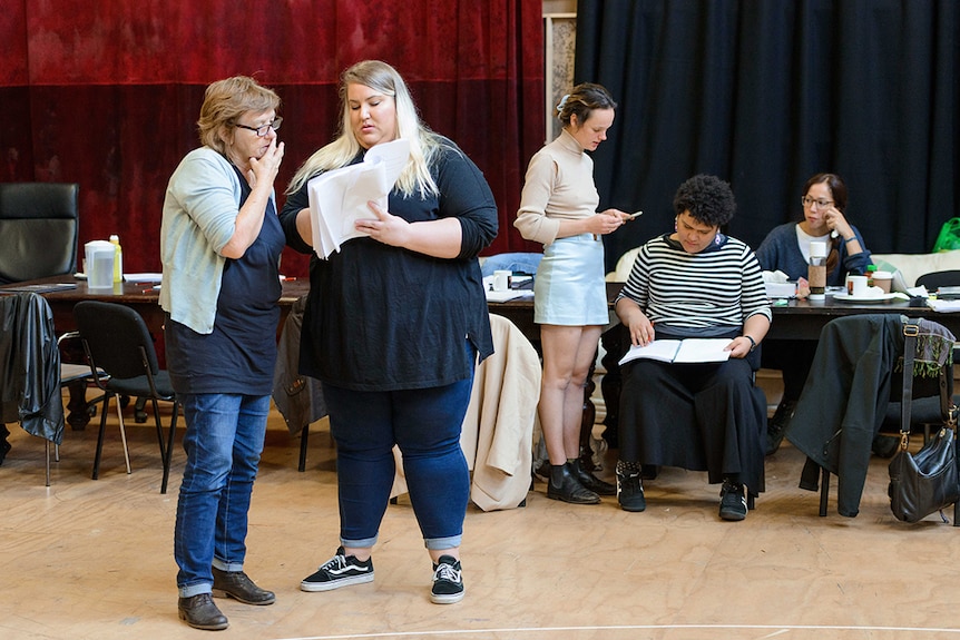 Colour photo of Patricia Cornelius, left, and Bessie Holland chatting during rehearsals for The House of Bernarda Alba in 2018.