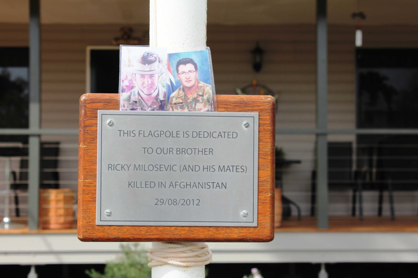 A flag pole stands in Milan Milosevic's front yard to honour his brother, Lance Corporal Stjepan Milosevic.